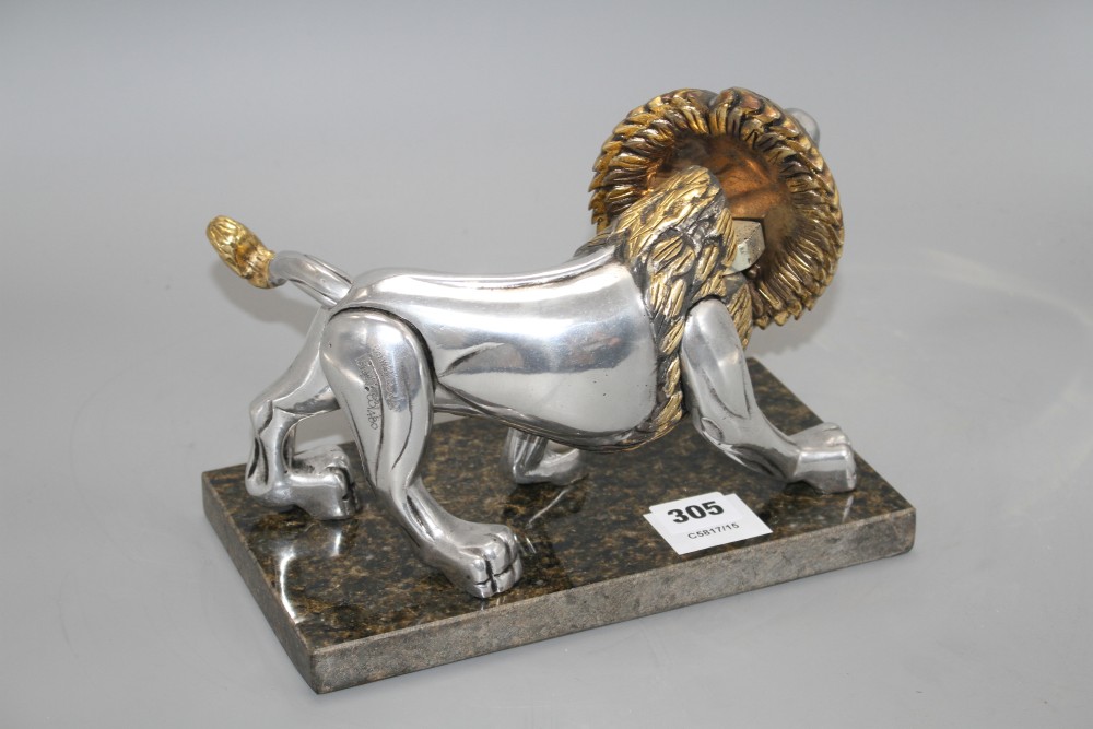 A Frank Meisler parcel gilt pewter model of a lion, no.83/480, on marble stand, length 27cm